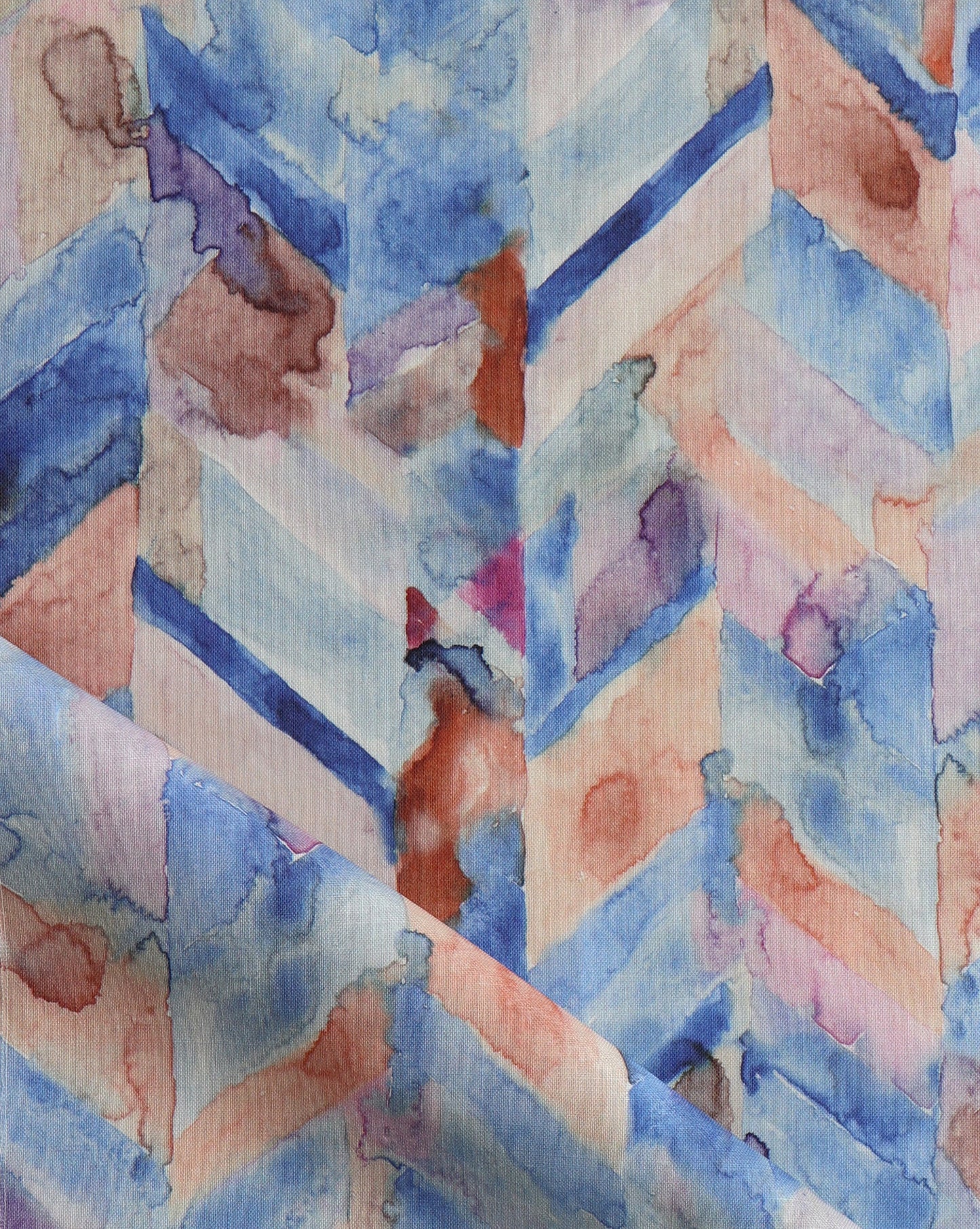 Luxurious Sorisa fabric presents a rich chevron pattern, with the Reef colorway made up of blue with earth tones and purple highlights