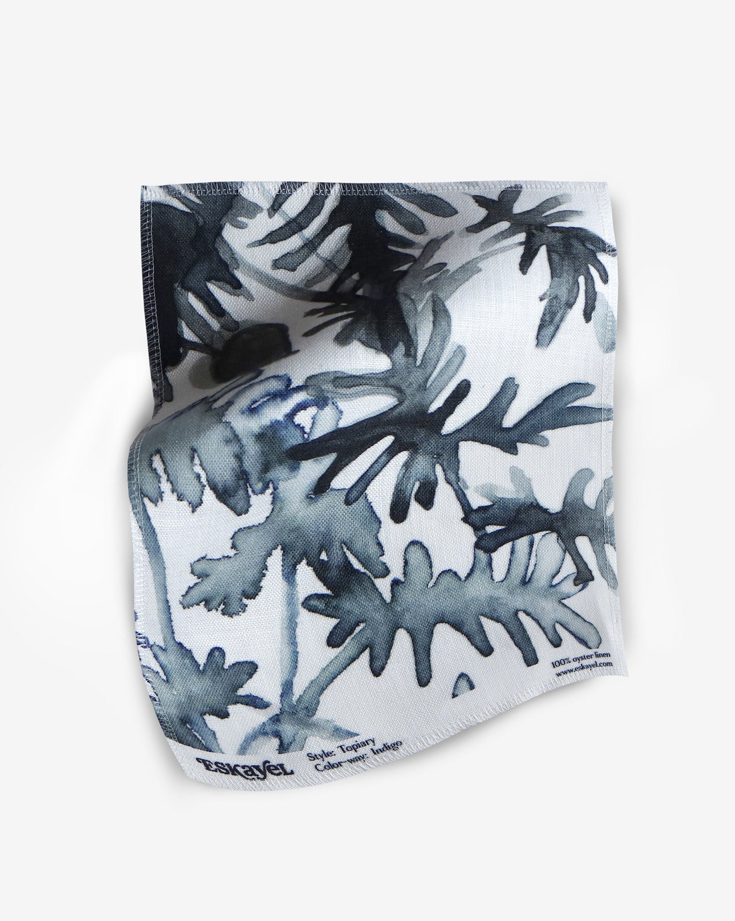 A fabric with our topiary pattern featuring a botanical design of varying indoor plants in navy blue and white.
