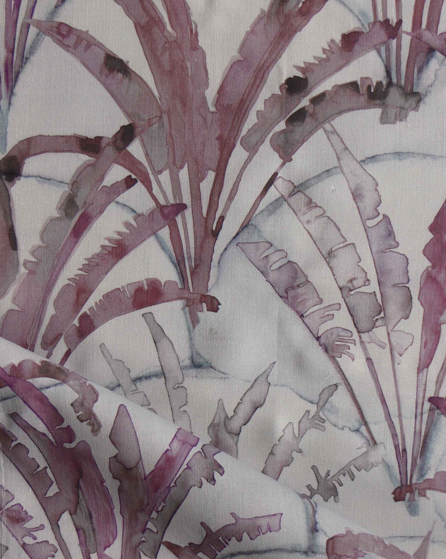 A purple and white Travelers Palm Fabric Pomegranate with a watercolor pattern from Mexico