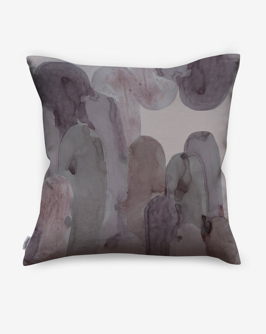 Arcos luxury pillows in Pomegranate offer magentas and greys as a soft geometric pattern of curves and columns