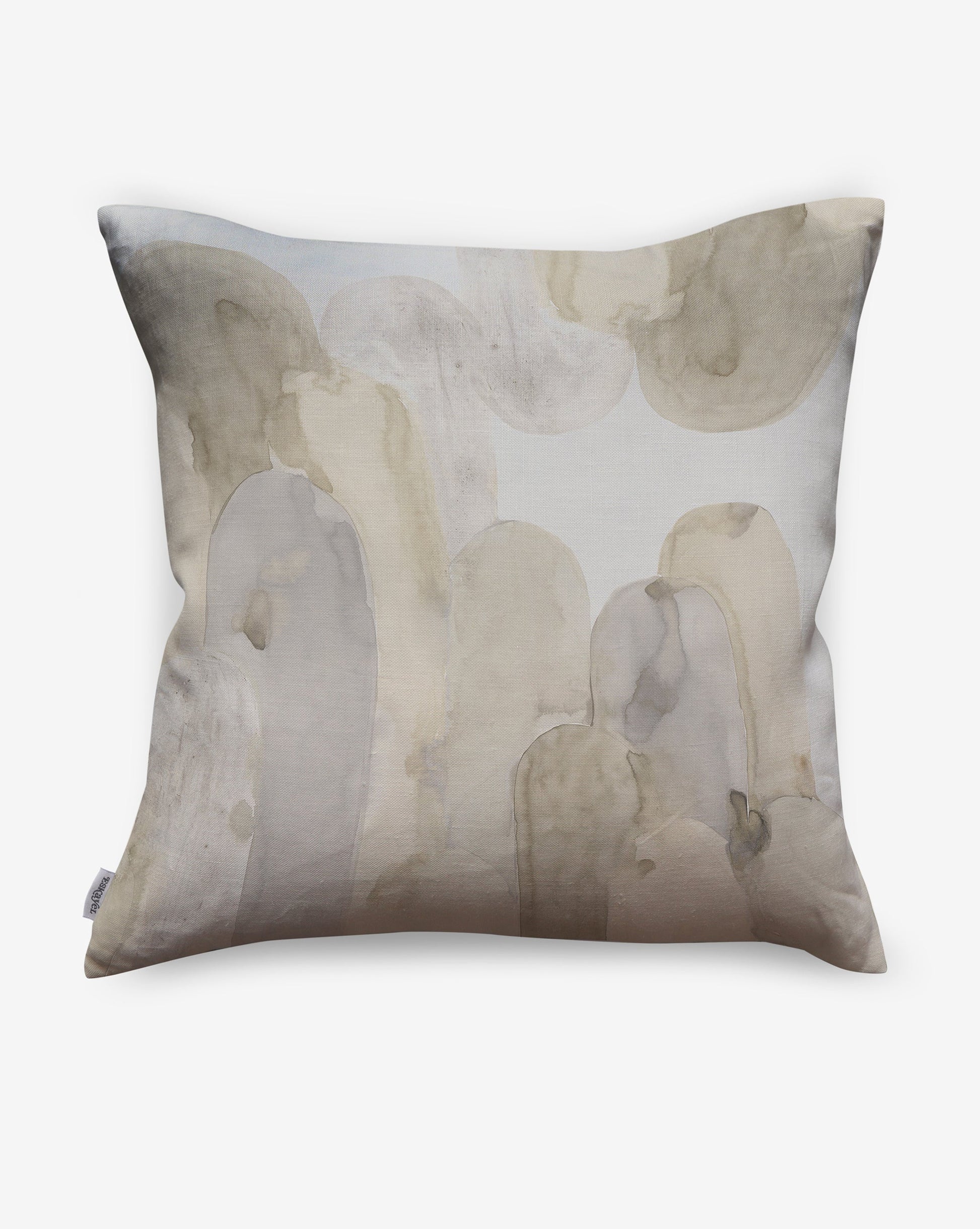 Arcos pillows in Sol present beige, cream and grey shades as a geometric pattern of curves and columns