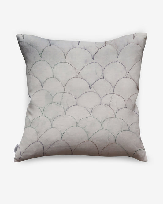 Baby Scallops pillows in Dusk present muted pinks with hints of sage green as a geometric pattern of overlapping curves