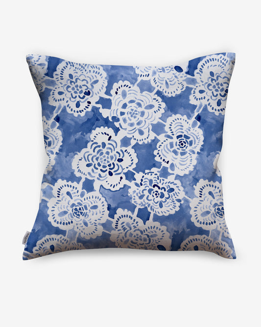 Drawn from handmade heirloom lace, the Margherita pillow in Fresco Blue offers a loose floral lattice in blues.