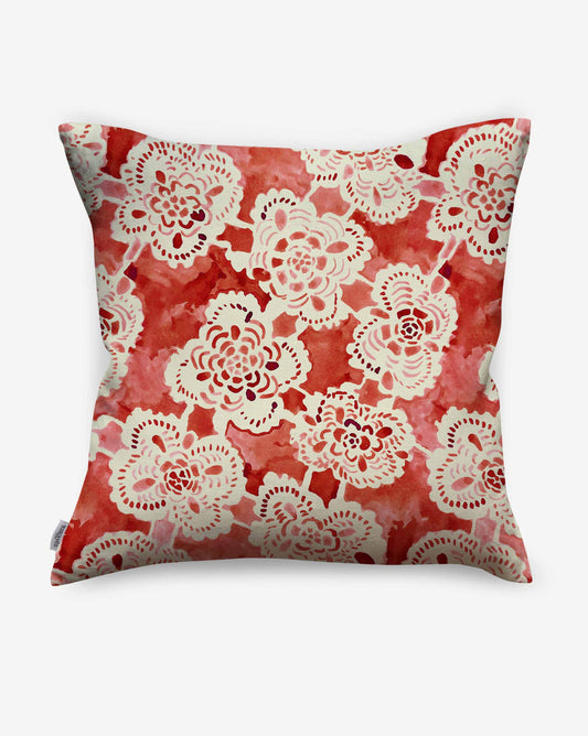 Warm red Margherita pillows in the Pomodoro colorway display a loose painted pattern of floral lace.