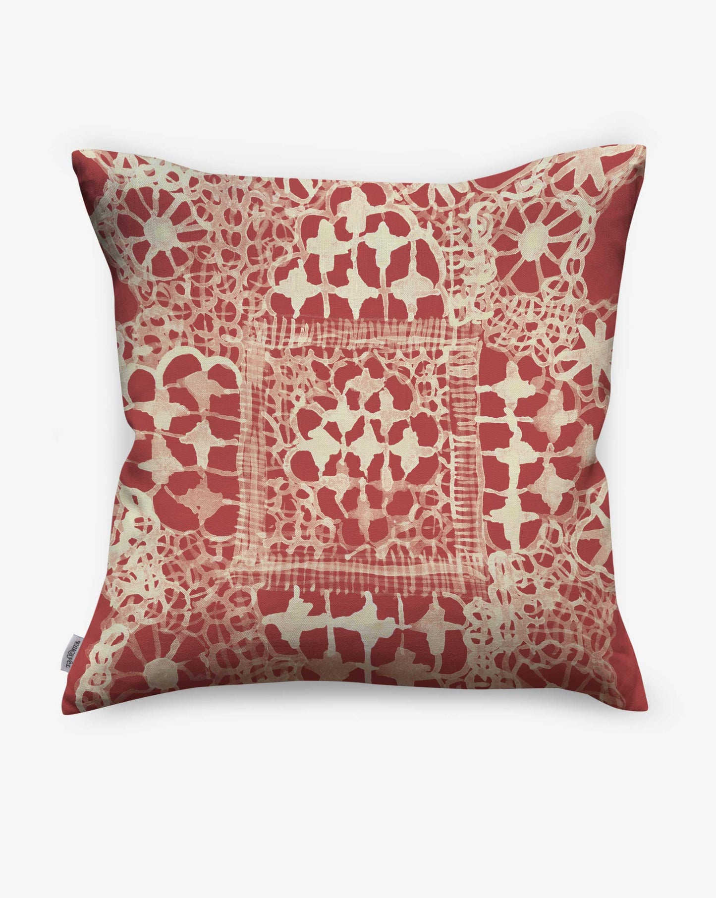 Displaying a vintage lace pattern reinterpreted in watercolor, Nonna’s Lace pillows in Pomodoro offer warm reds.