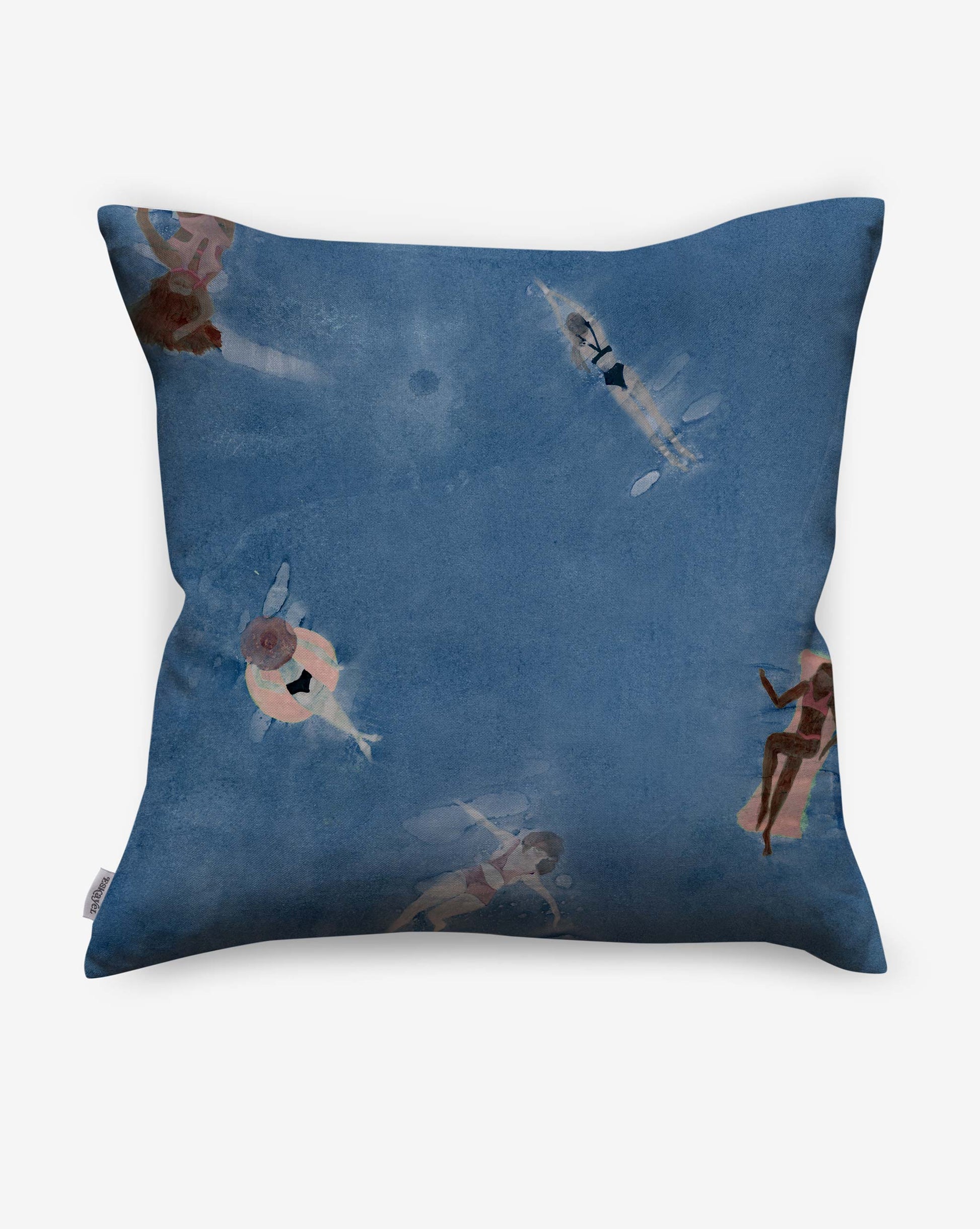 The Swim Pillow in Lake is a square cushion with a blue back cover featuring a watercolor-style print of swimmers viewed from above—an ideal accent for adding beach house charm.