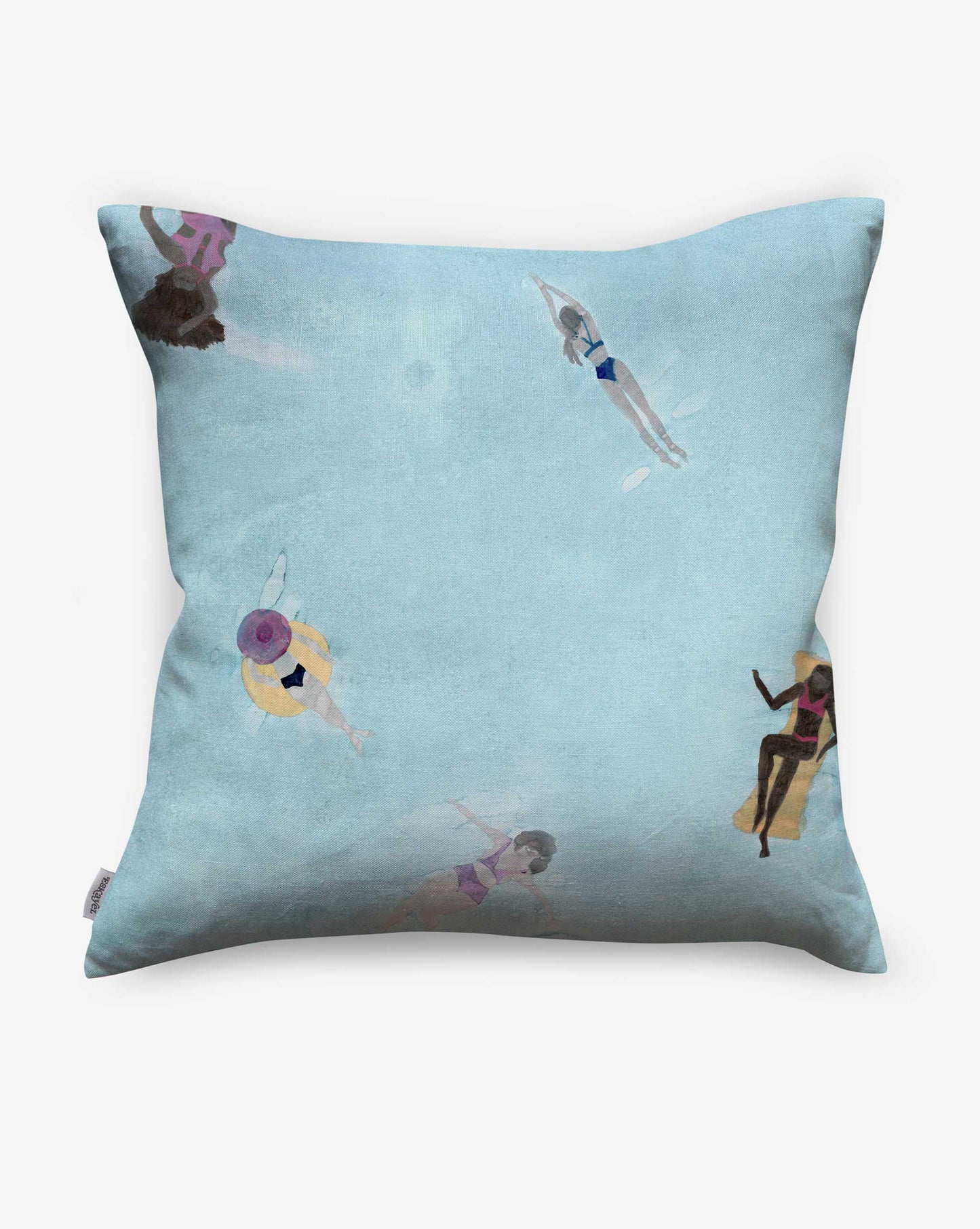The Swim Pillow Sea is a light blue cover featuring a playful print of people swimming and floating in a pool, as seen from above on the back.
