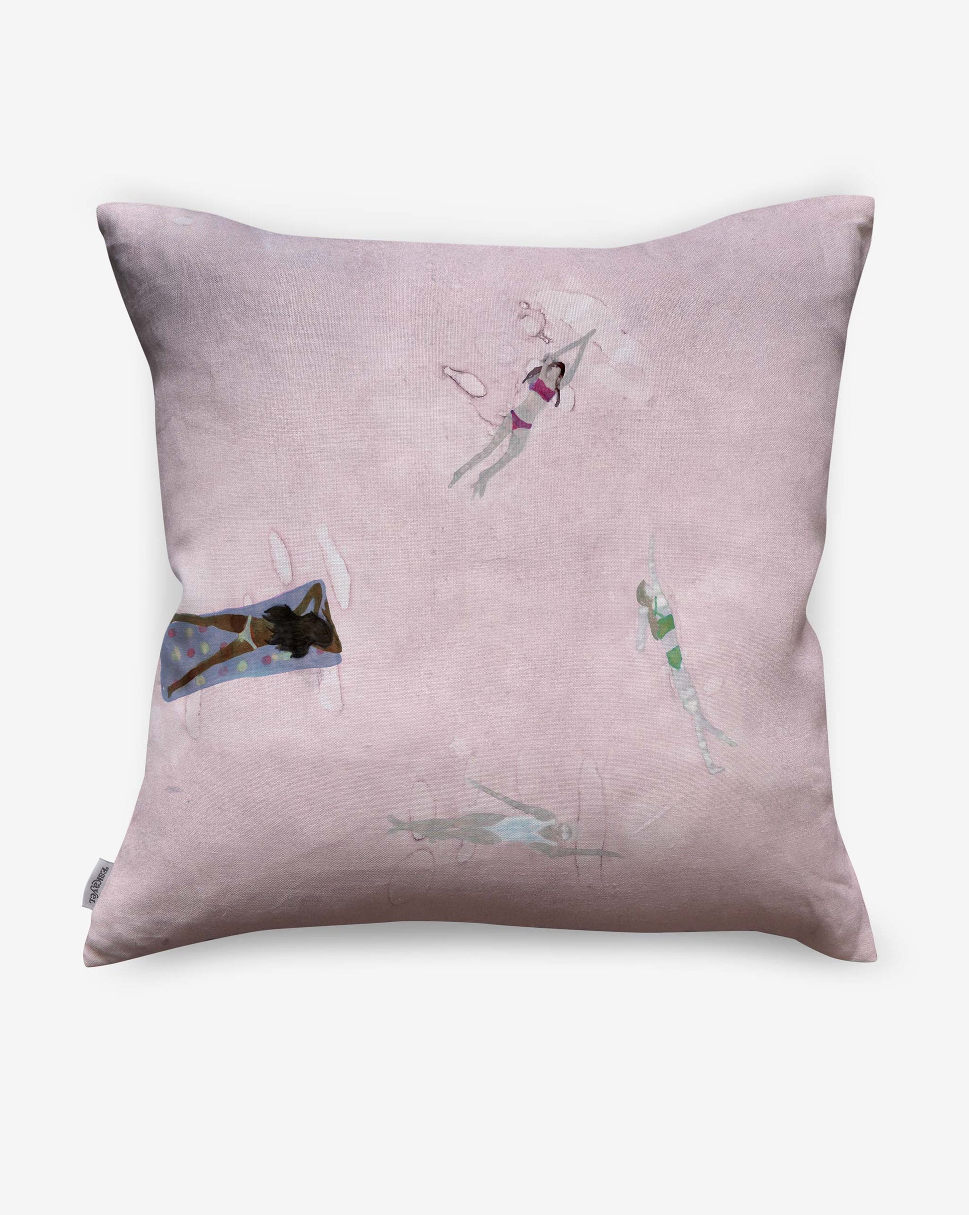 The Swim Pillow in Shell has a pale pink background, showcasing four illustrated swimmers in different poses for a beach house feel and elegant watercolor style on the front.