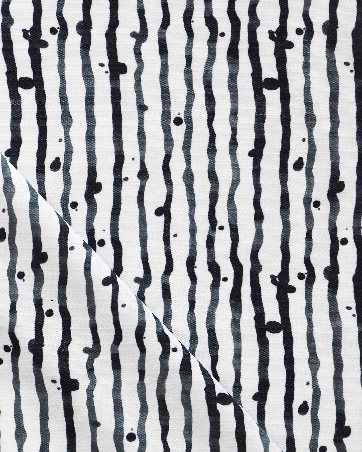 Drippy Stripe Performance Fabric Slate design featuring black and white stripes on a luxury performance fabric