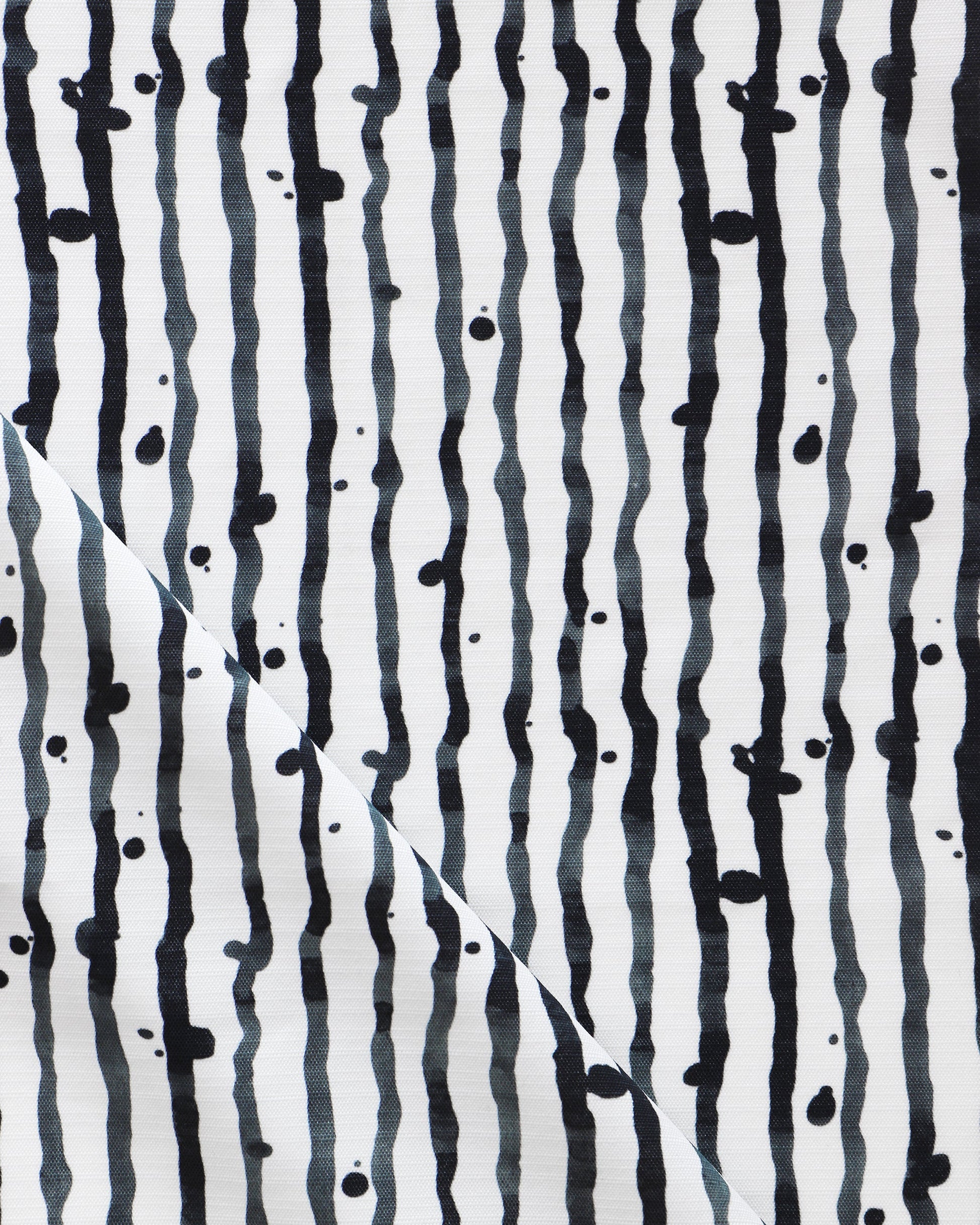 Drippy Stripe Performance Fabric Slate design featuring black and white stripes on a luxury performance fabric