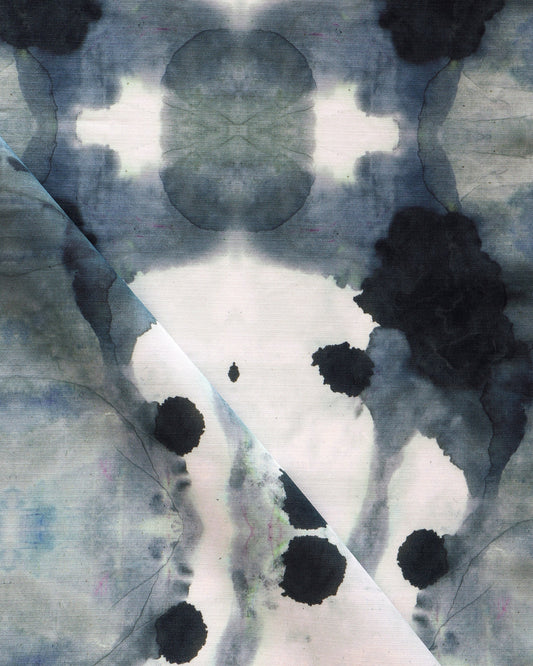 A close up of a black and white ink stain on a piece of Dynasty Performance Fabric Indigo
