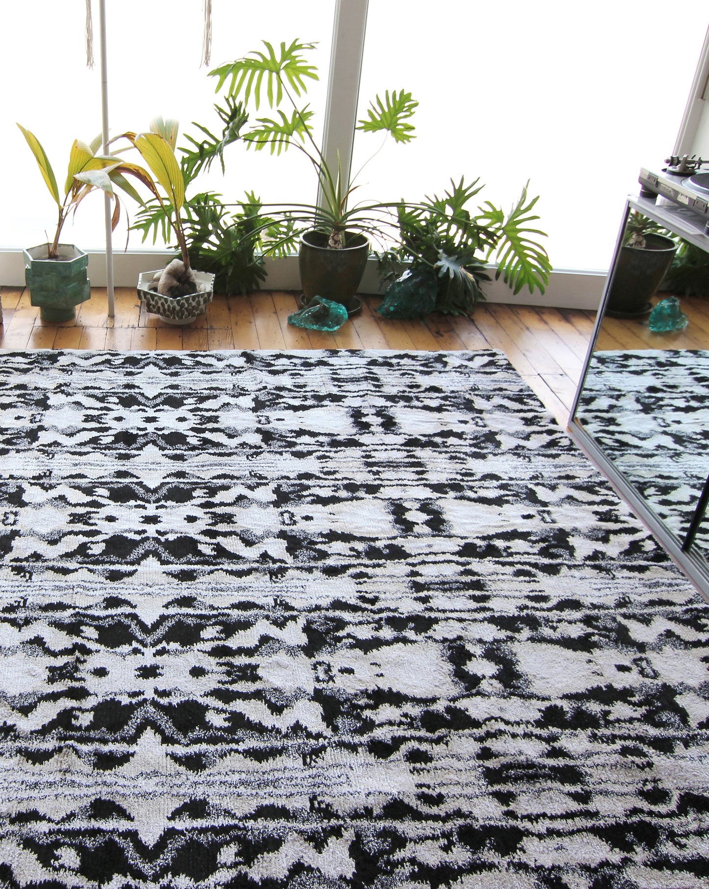 A Biami Hand Knotted Rug 8' x 10' Black in a living room