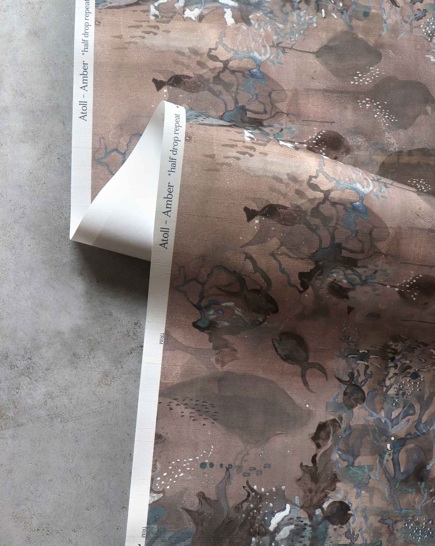 A close up detailed shot of Eskayel’s Atoll wallpaper in Amber with its brown hues.