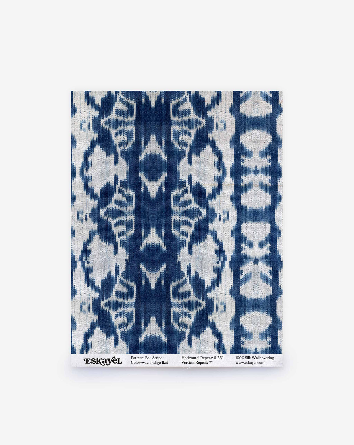 A Bali Stripe Silk Sample in Indigo Ikat featuring a blue and white ikat stripe pattern, with a label at the bottom detailing how to order a sample.