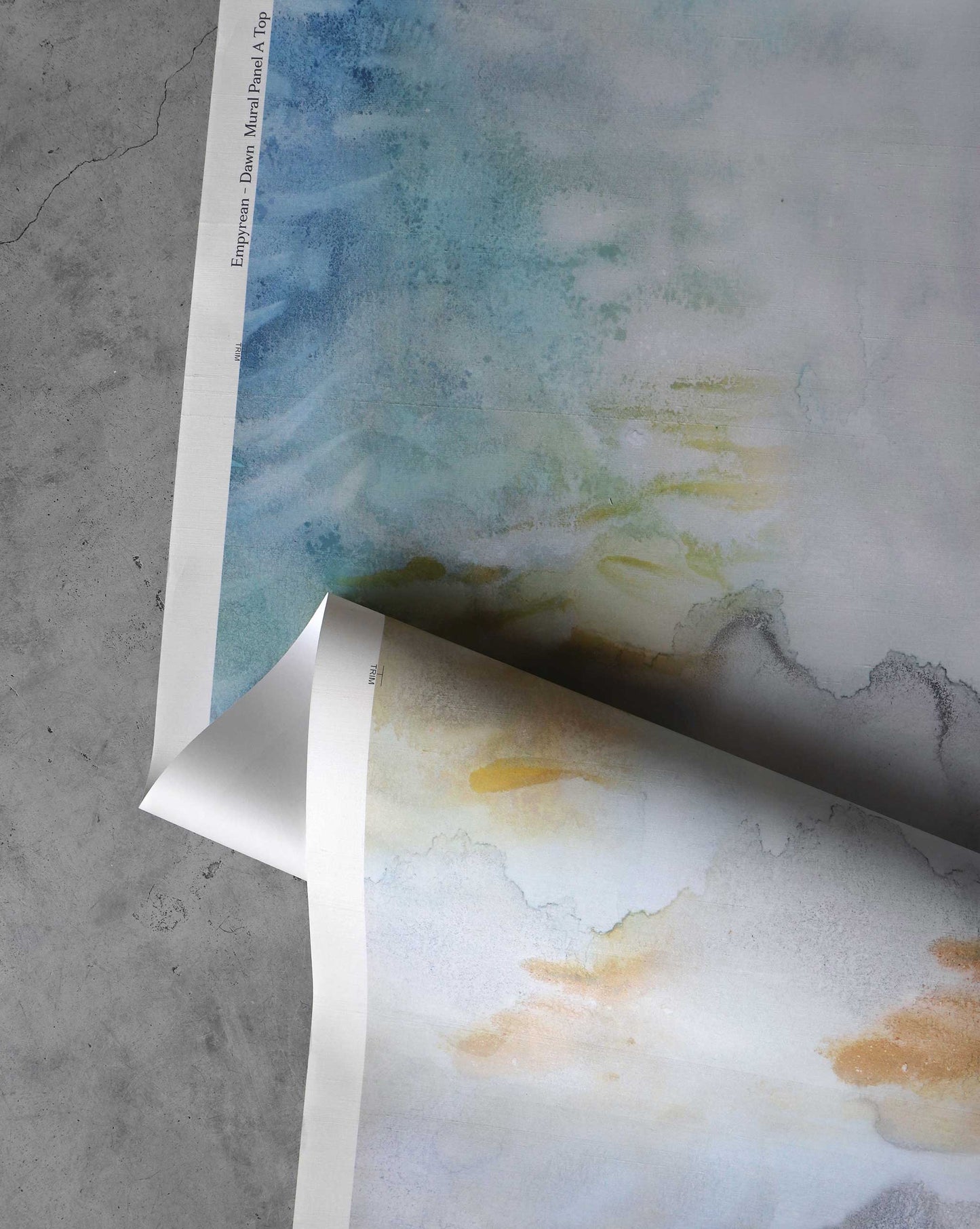 A detailed shot of Eskayel’s Empyrean wallpaper mural in the colorway Dawn which has a warm and cool multicolored palette.