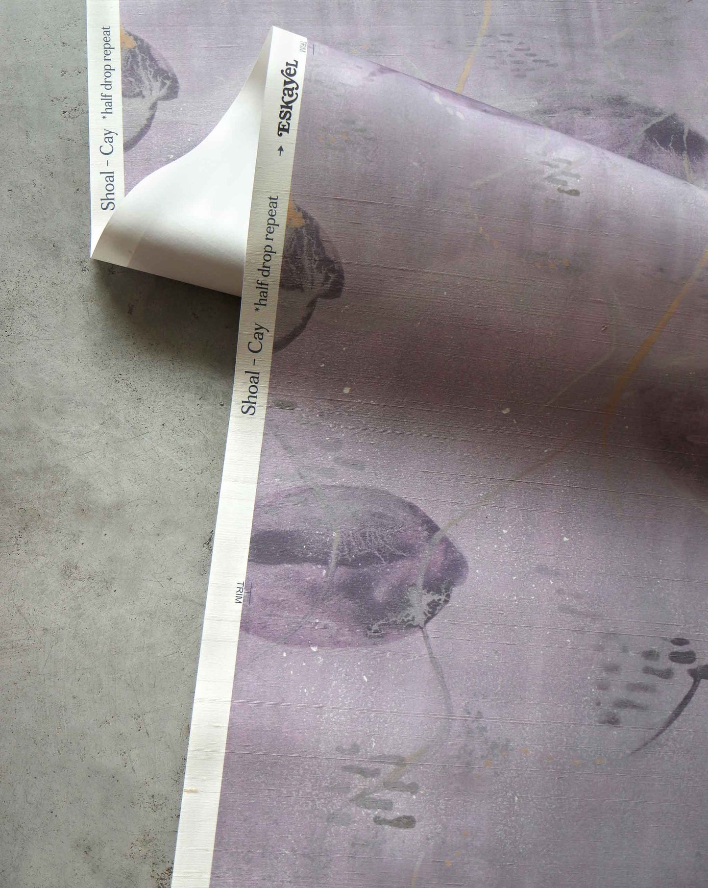 A detailed shot of Eskayel’s Shoal wallpaper in the colorway Cay with its purple hues.