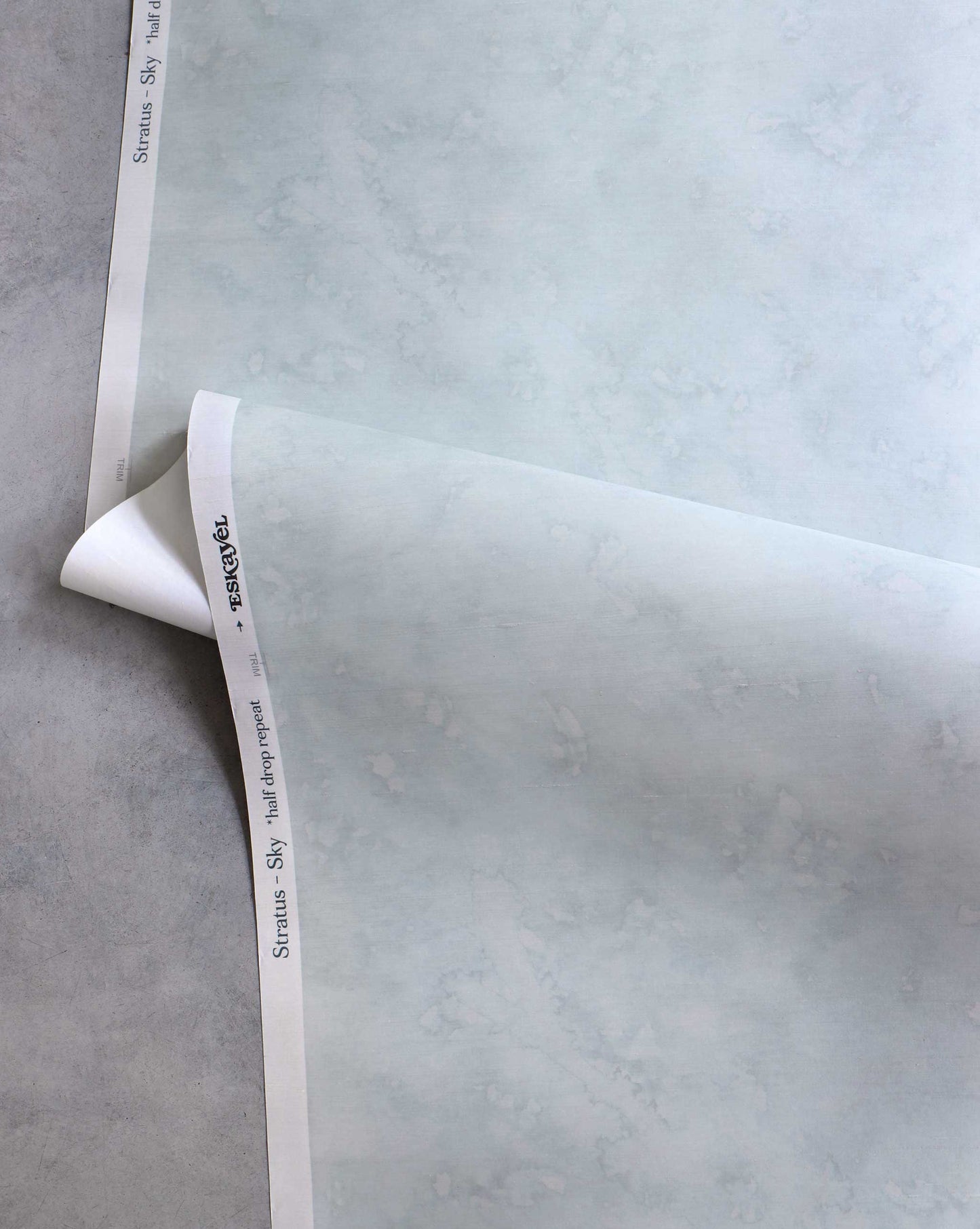 A detailed shot of Eskayel’s Stratus wallpaper in the colorway Sky with its light blue hues.