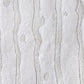 A close up of the Drippy Stripe Hand Knotted Rug 9' x 12' in Lefko White