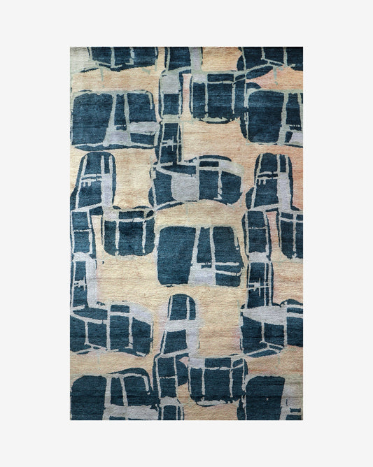 A blue and beige Quotidiana Hand Knotted Rug 5' x 8' Corinth design with abstract designs on it