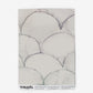 A white paper with a marble pattern on it from the Baby Scallop Wallpaper Dusk collection