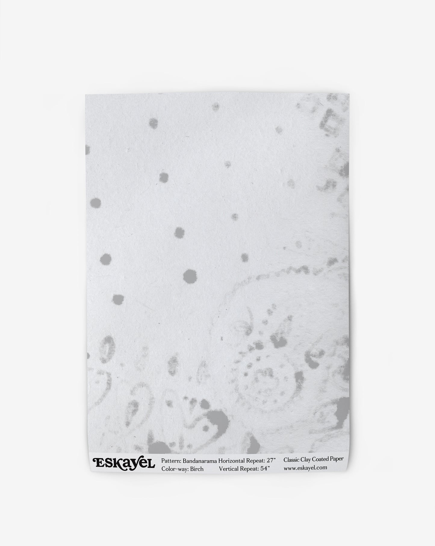 A Bandanarama Wallpaper Birch pattern with black polka dots on it