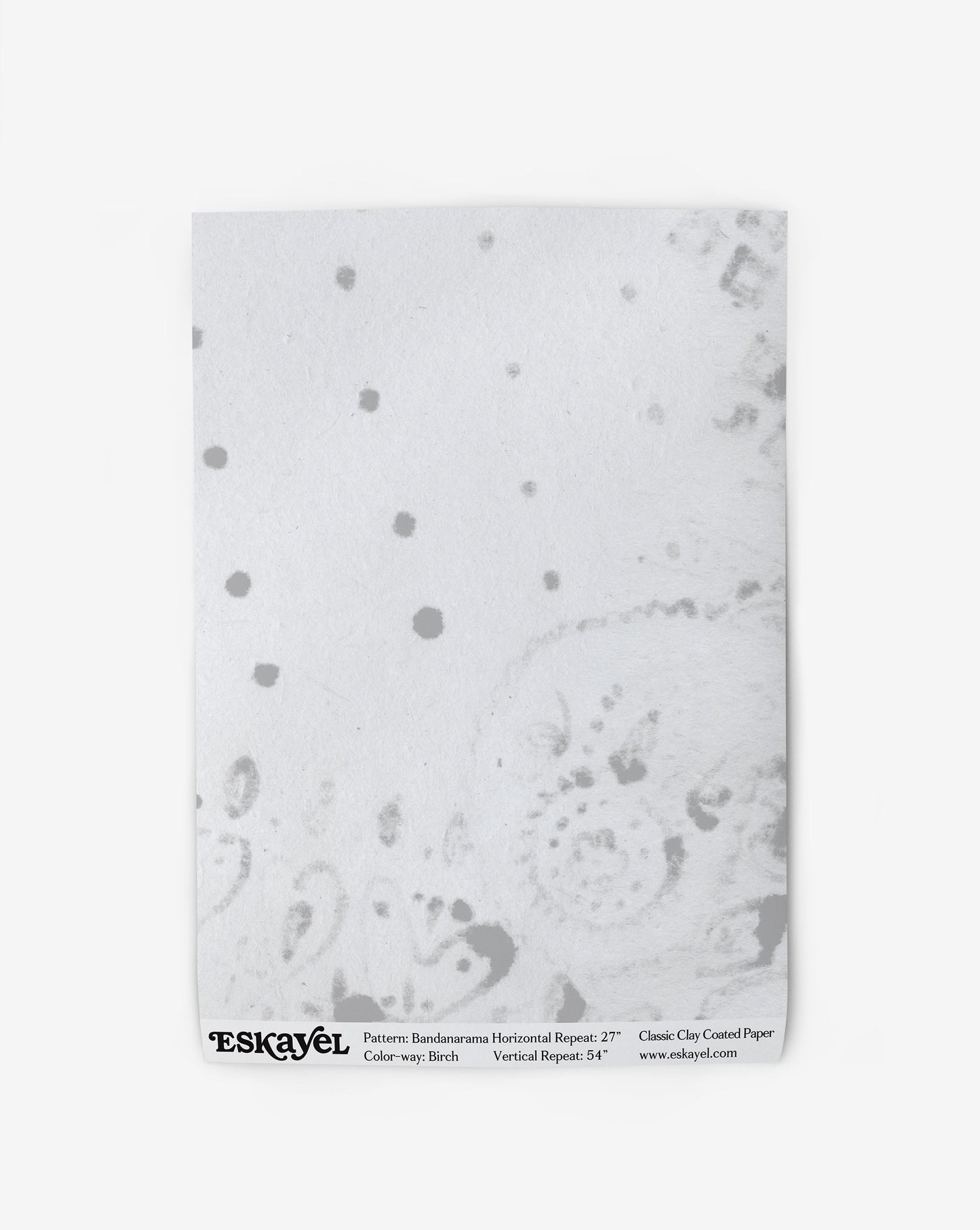 a sample of the Bandanarama Wallpaper Sample Birch with black dots on it