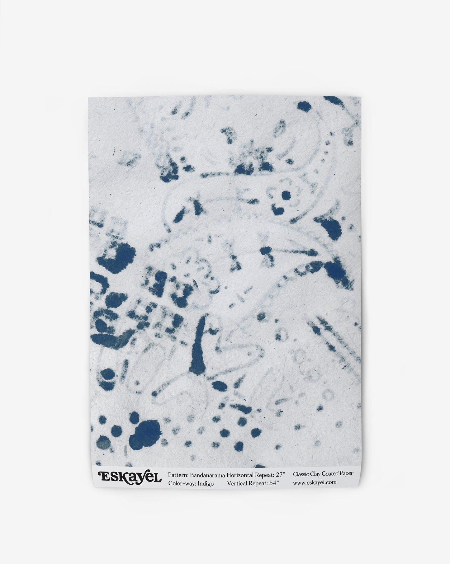 A blue and white Bandanarama Wallpaper Indigo with a playful pattern of polka dots