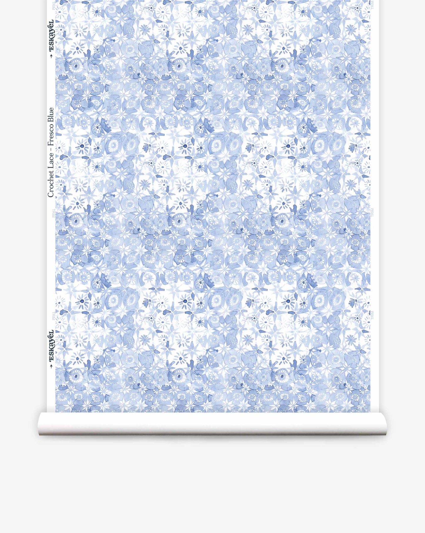 Crochet Lace wallpaper in Eskayel’s Fresco Blue colorway is a watercolor pattern of flowers on a loose grid of squares.
