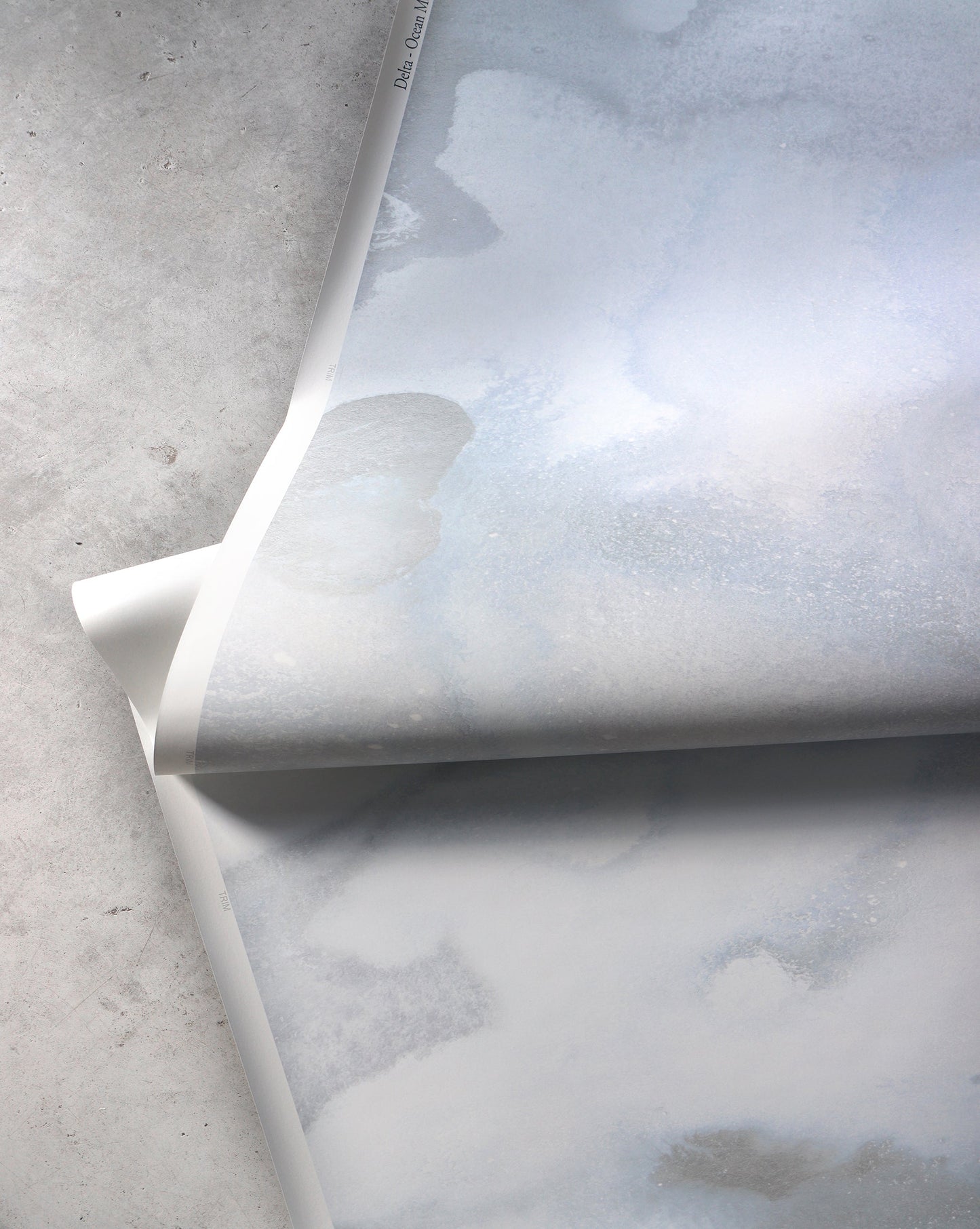 An image of Delta Ocean Wallpaper Mural with blue tones and a pattern that conveys the slow journey from consciousness to a dream state.