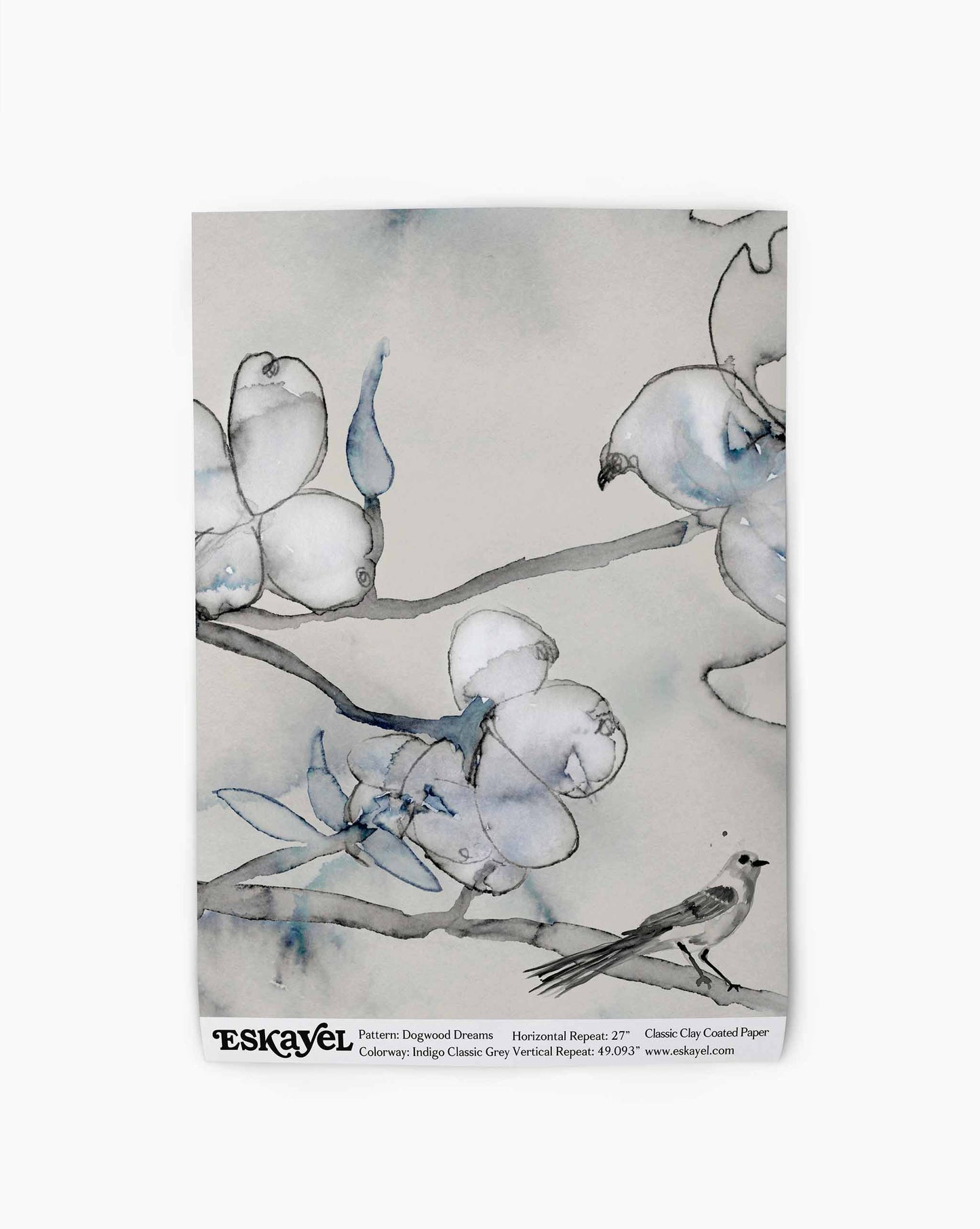 Initially created in collaboration with MG+BW, Dogwood Dreams in Indigo Classic Grey is a botanical wallpaper in a palette of beige and blue tones.