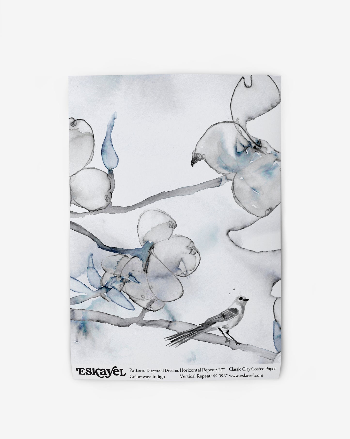 A blue and white Dogwood Dreams Wallpaper Indigo colorway wallpaper with birds on a branch