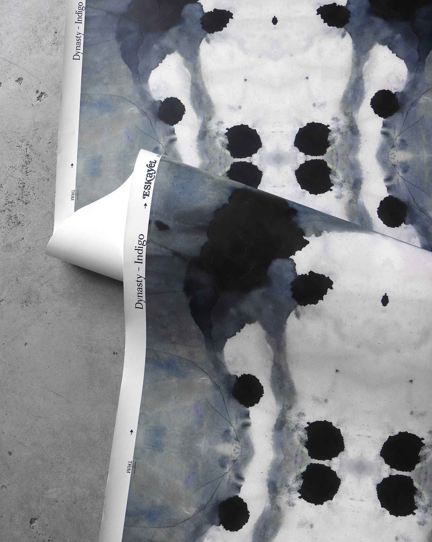 A detail shot of Eskayel's Dynasty wallpaper in the colorway Indigo has a deep navy palette.