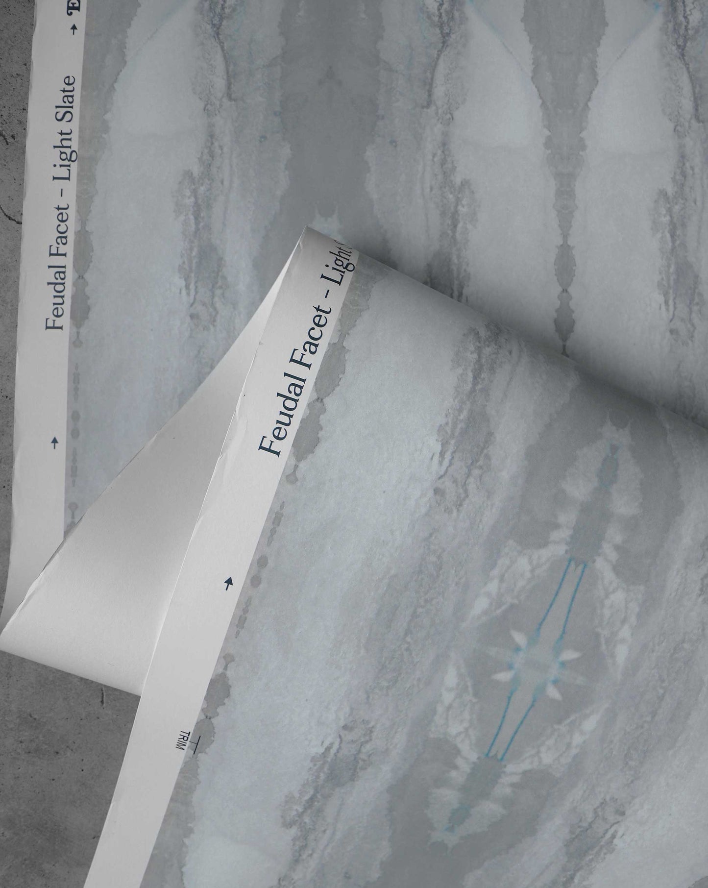 A detail shot of Eskayel's Feudal Facet wallpaper in the colorway Light Slate.