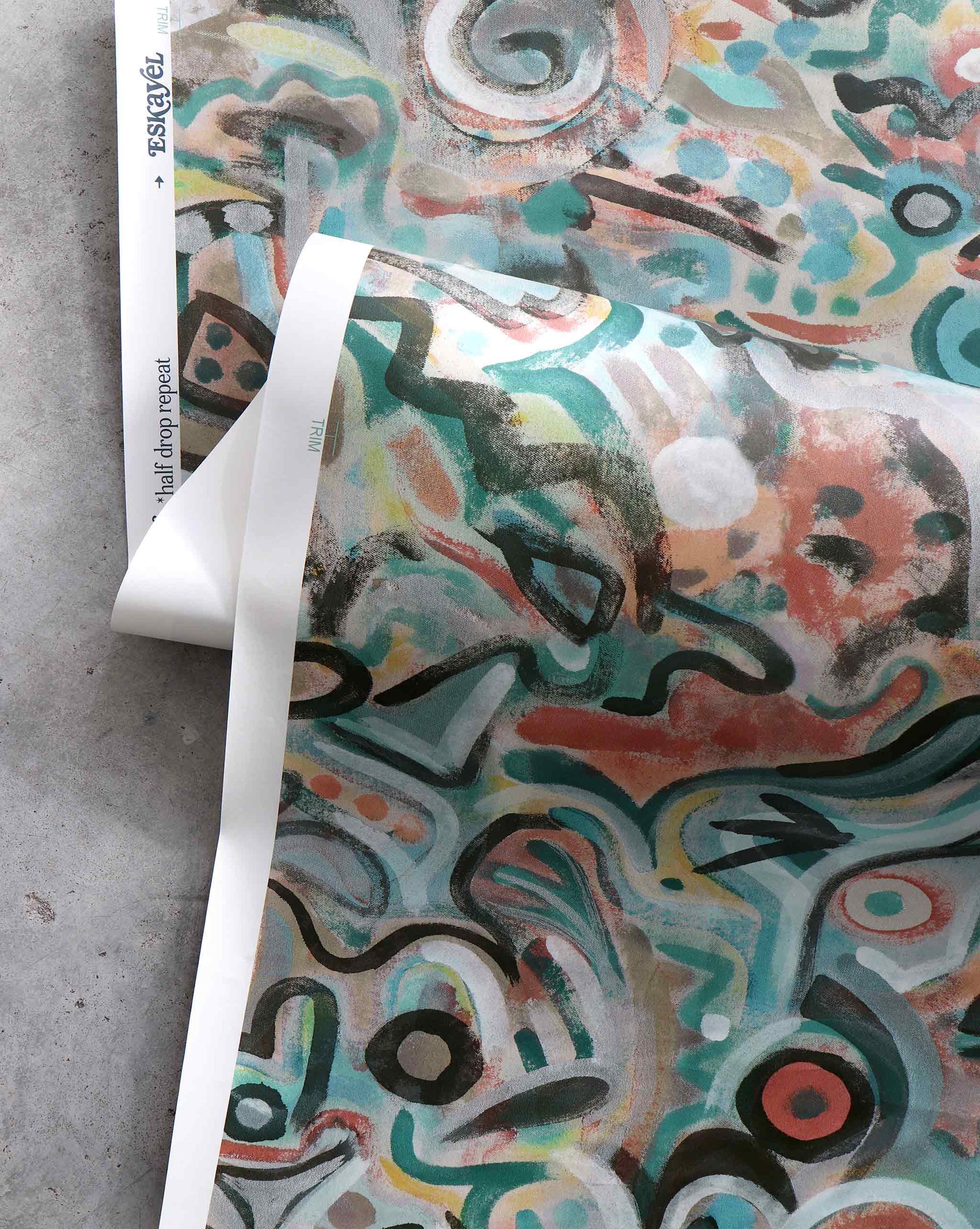 An image of Floripa Reef Wallpaper with salmon and turquoise tones. The pattern is inspired by the beautiful tropical island of Florianopolis in Brazil.