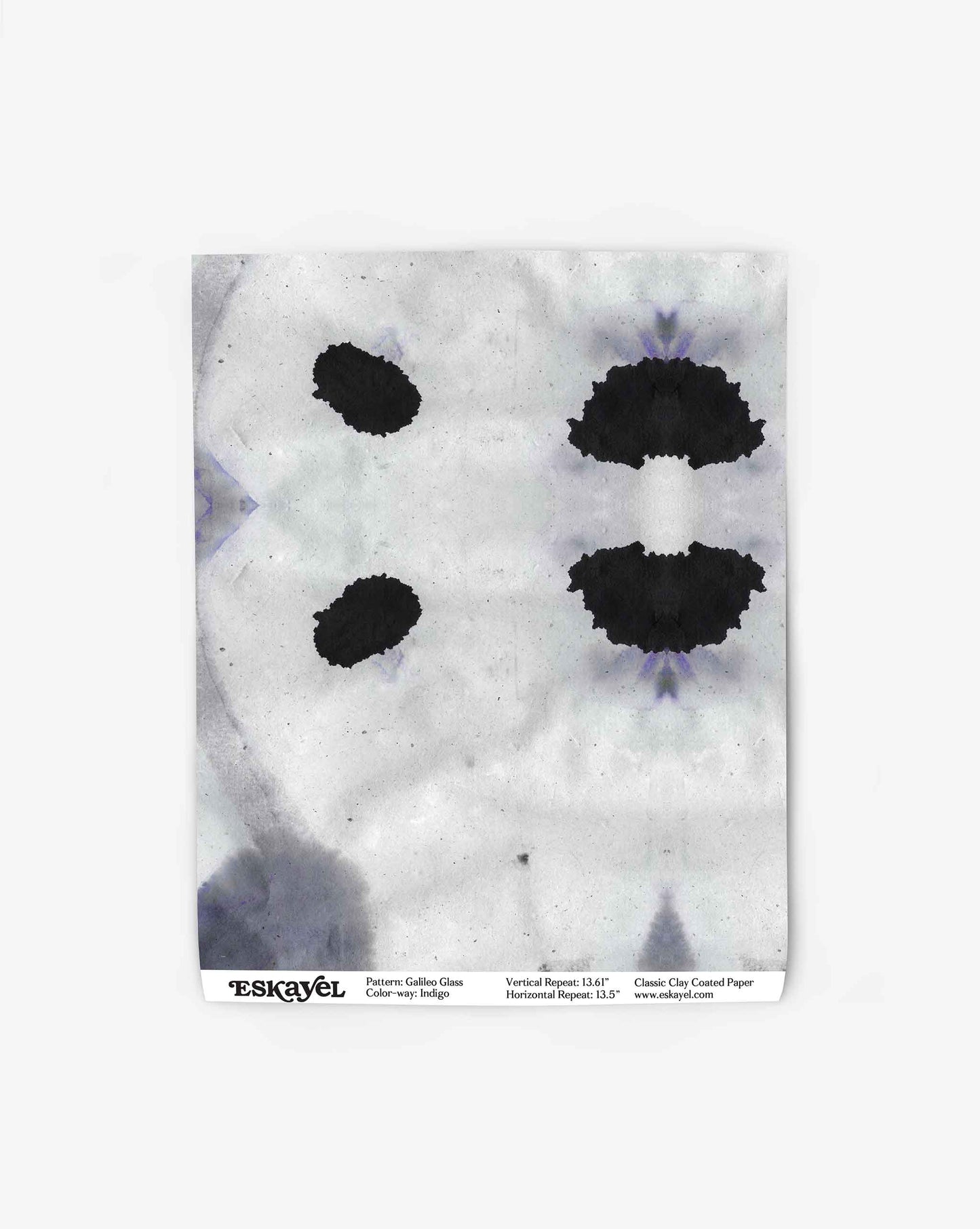 An inkblot resembling a symmetrical abstract shape on a white background, presented in an indigo colorway with "Galileo Glass Wallpaper||Indigo" text and dimensions at the bottom edge, making it perfect for high-end wallpaper featuring abstract patterns.