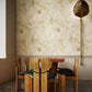 Eskayel's Hibiscus Lily Pearl wallpaper is a yellow hued pattern installed in a dining room.