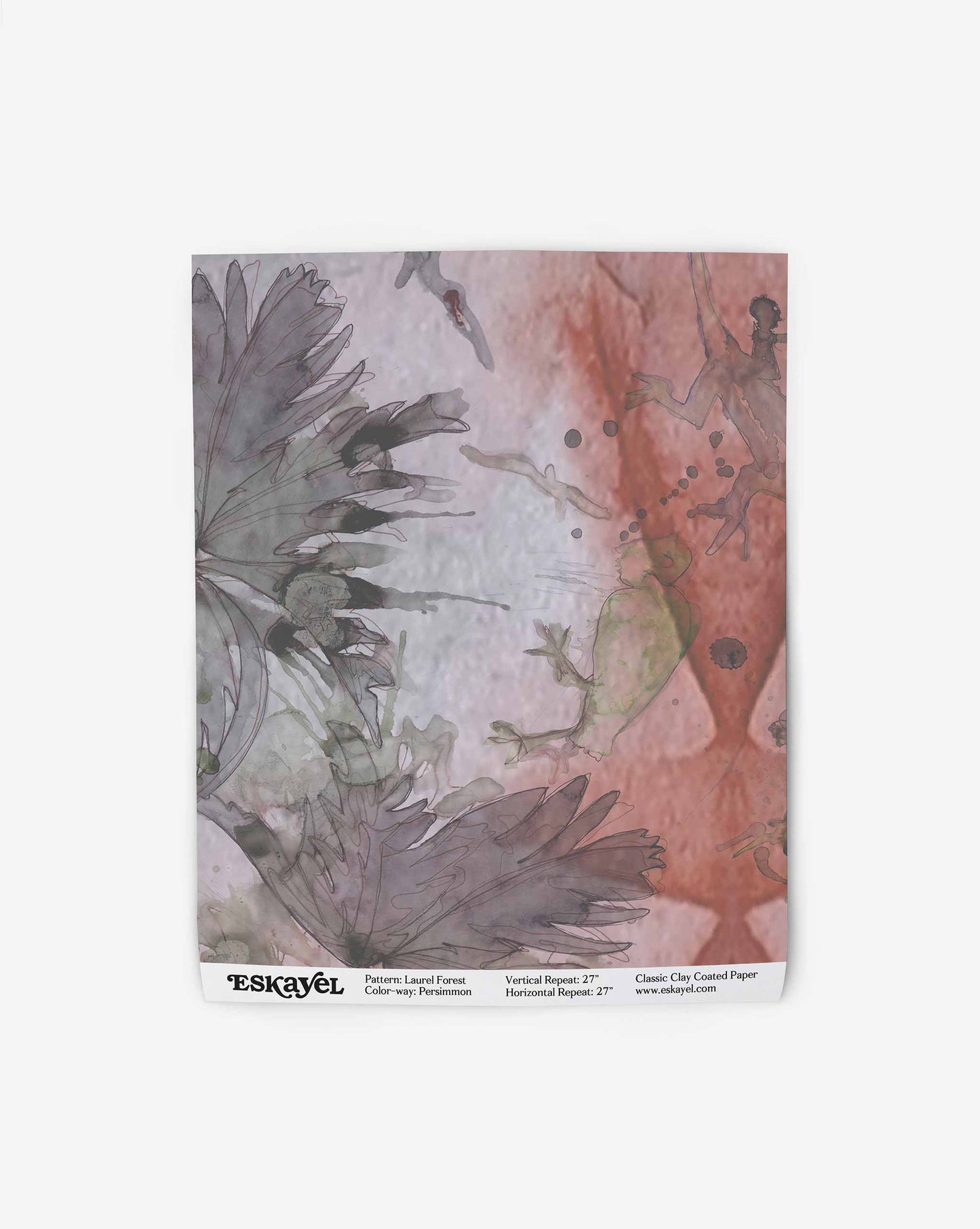 A sheet of Laurel Forest Wallpaper featuring a watercolor design with subtle grey leaves and splashes of soft red and black accents.