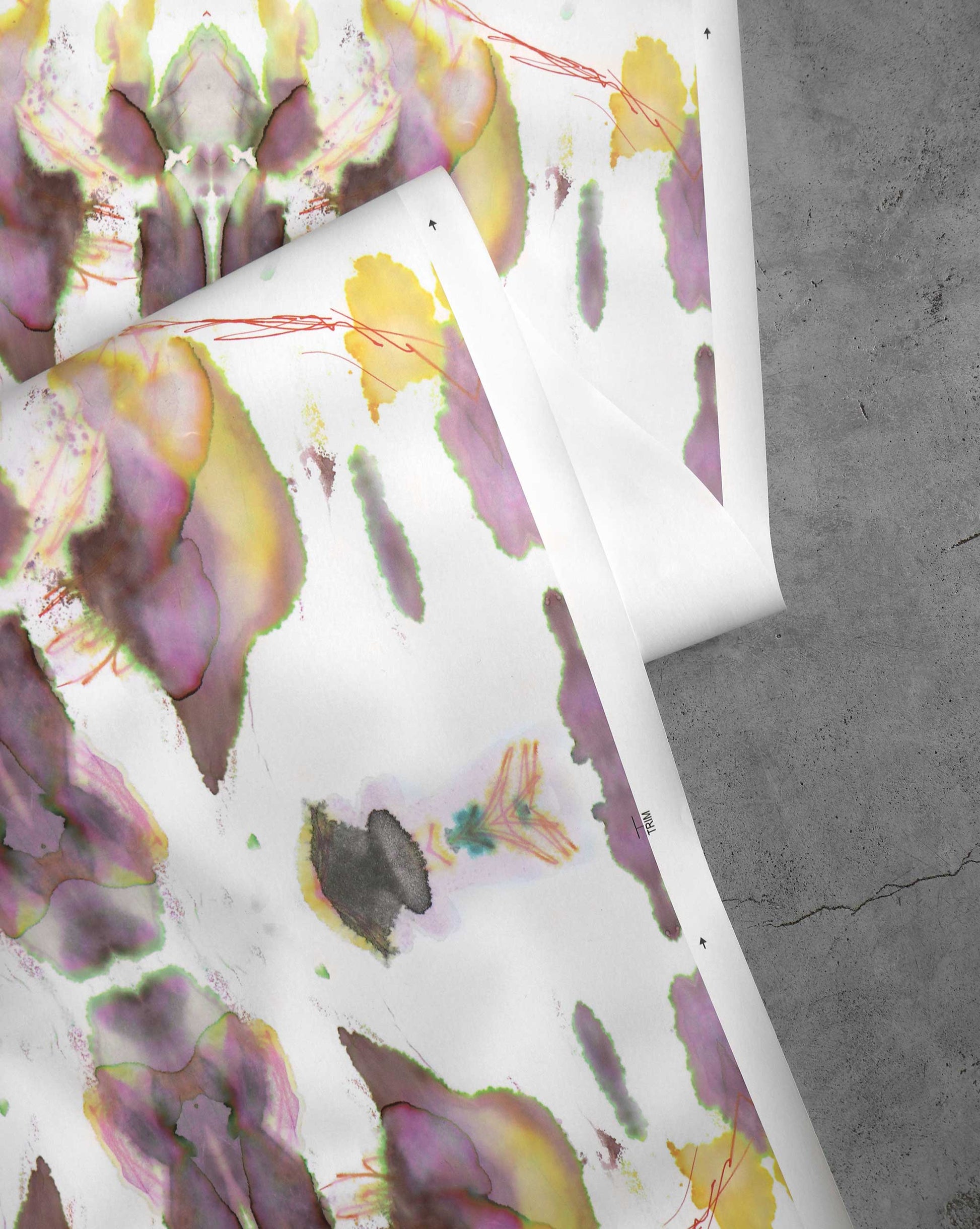 A detail shot of Madagascar Wallpaper in the colorway Bay which features a yellow and purple pattern with hints of orange and green.