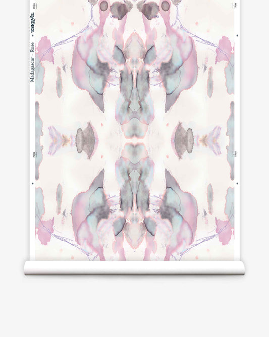 Luxury fabric Madagascar Wallpaper||Rose design in pastel colors on a scroll of paper, resembling a Rorschach test image.