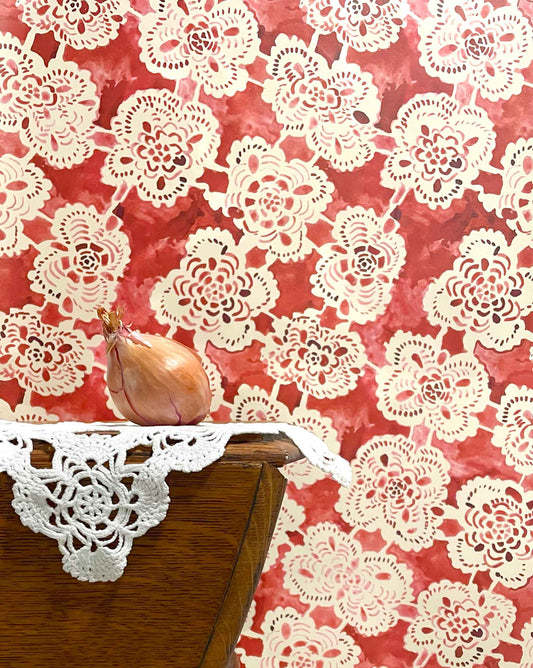 Drawn from handmade lace, Eskayel’s Margherita in Pomodoro is a floral wallpaper in a warm red colorway.