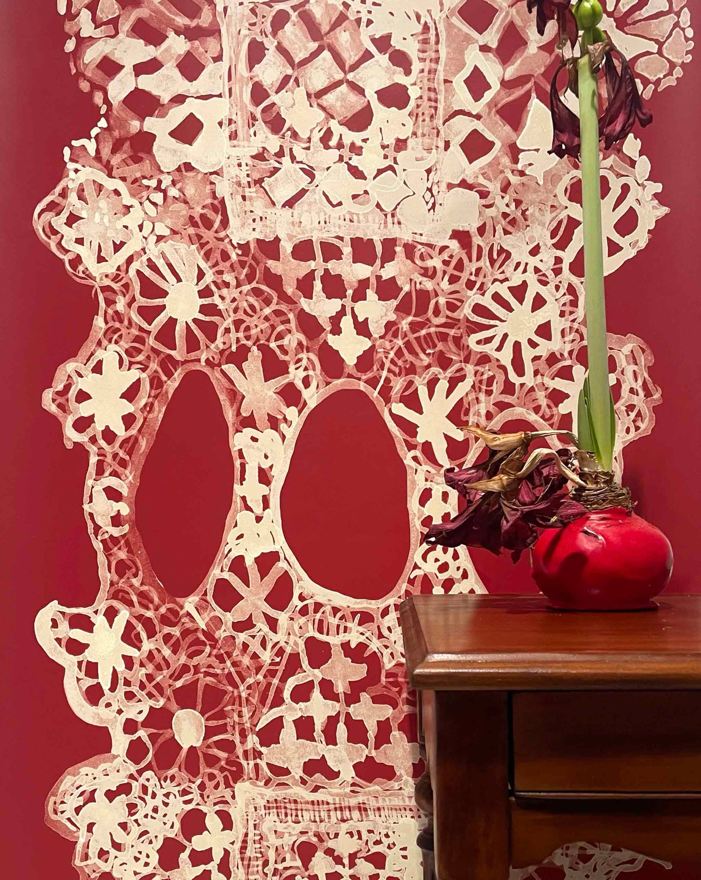 Nonna’s Lace in Pomodoro uses warm reds. The pattern can be laid out to create a large-scale stripe for wallpaper.