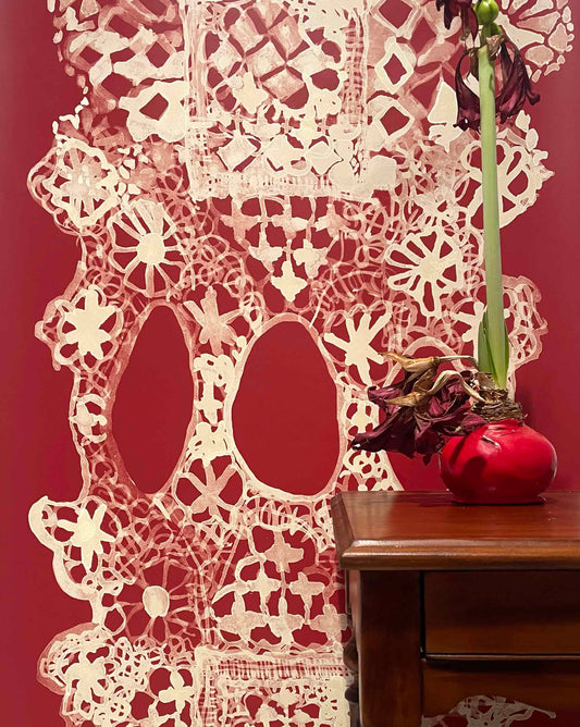 Nonna’s Lace in Pomodoro uses warm reds. The pattern can be laid out to create a large-scale stripe for wallpaper.