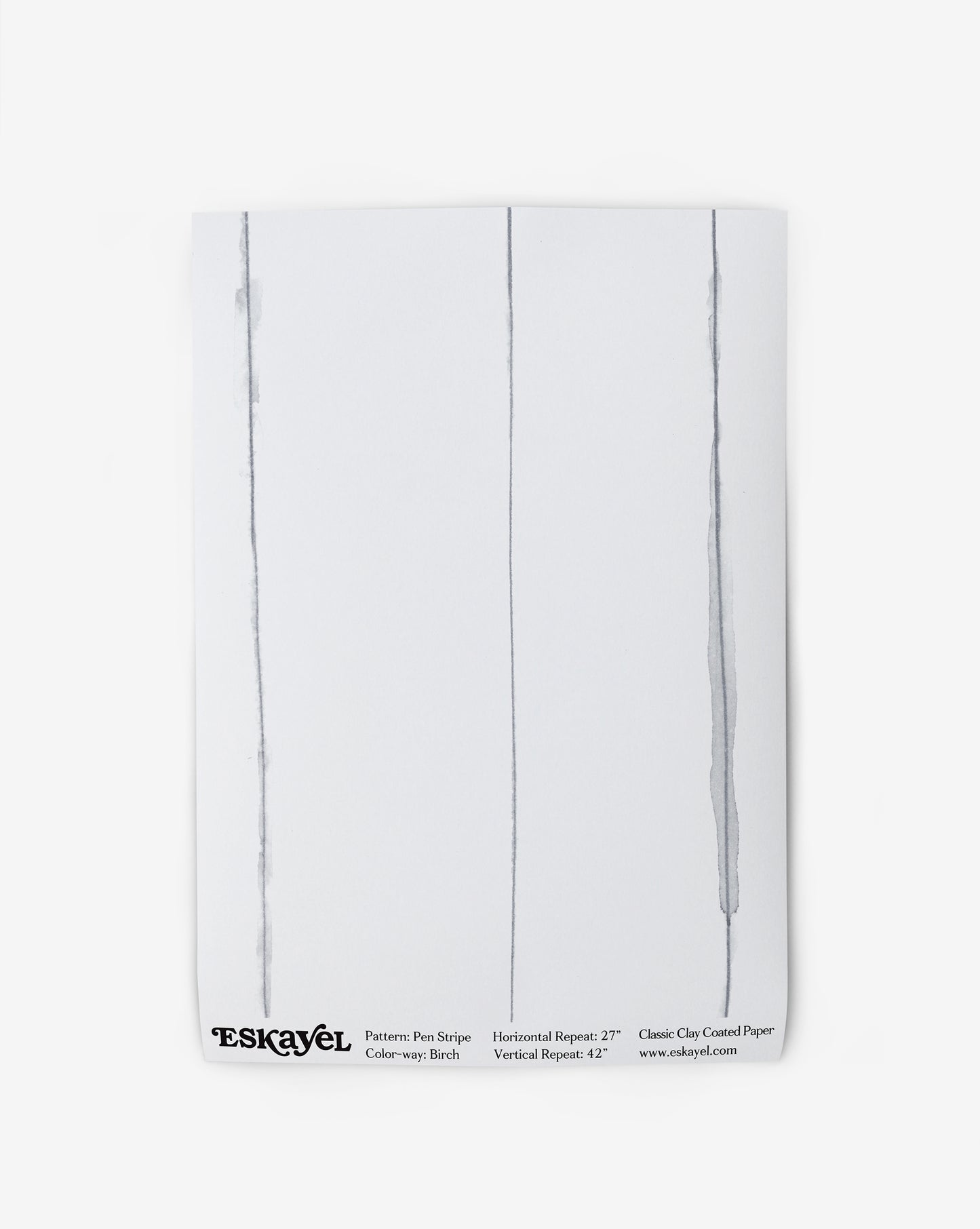 A white Pen Stripe Wallpaper||Birch with two lines drawn on it.