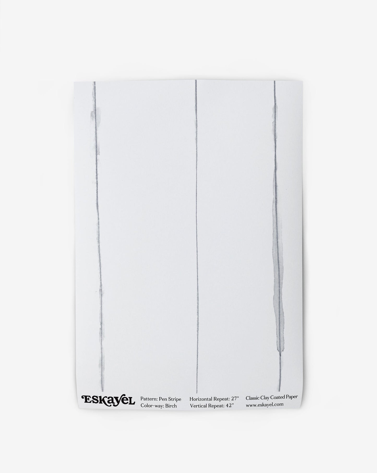 A white Pen Stripe Wallpaper Sample Birch with two lines drawn on it
