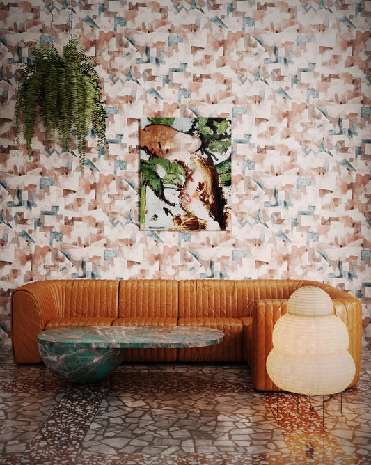 Eskayel's Pieces Amber wallpaper is an earthy blend of brown, blue and beige installed in a living room.