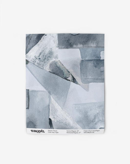 Our Pieces Wallpaper in Lapis has a design of puzzle pieces with color blocking in shades of blue.
