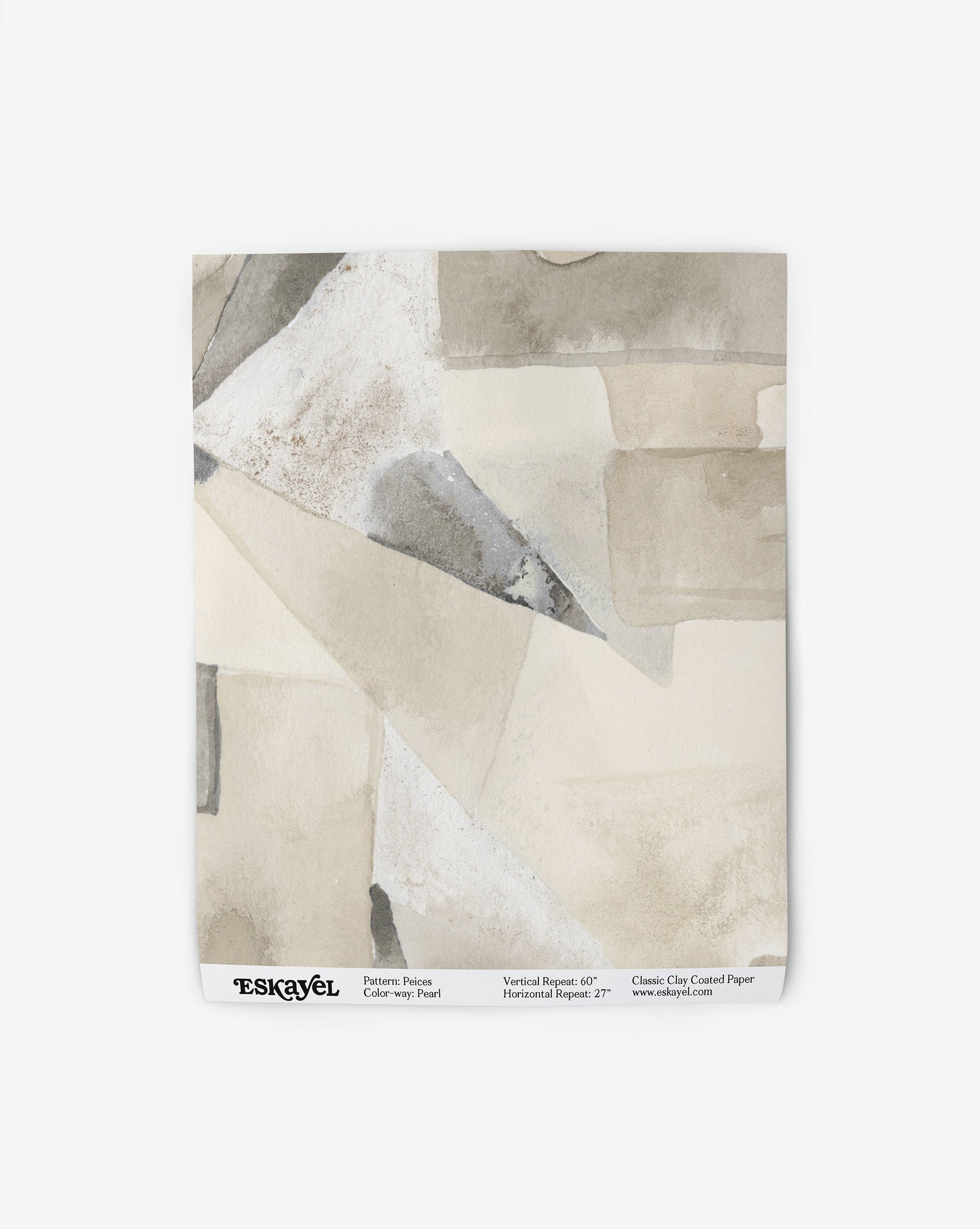 Our Pieces Wallpaper in Pearl has a design of color blocked puzzle pieces in yellow and beige shades.