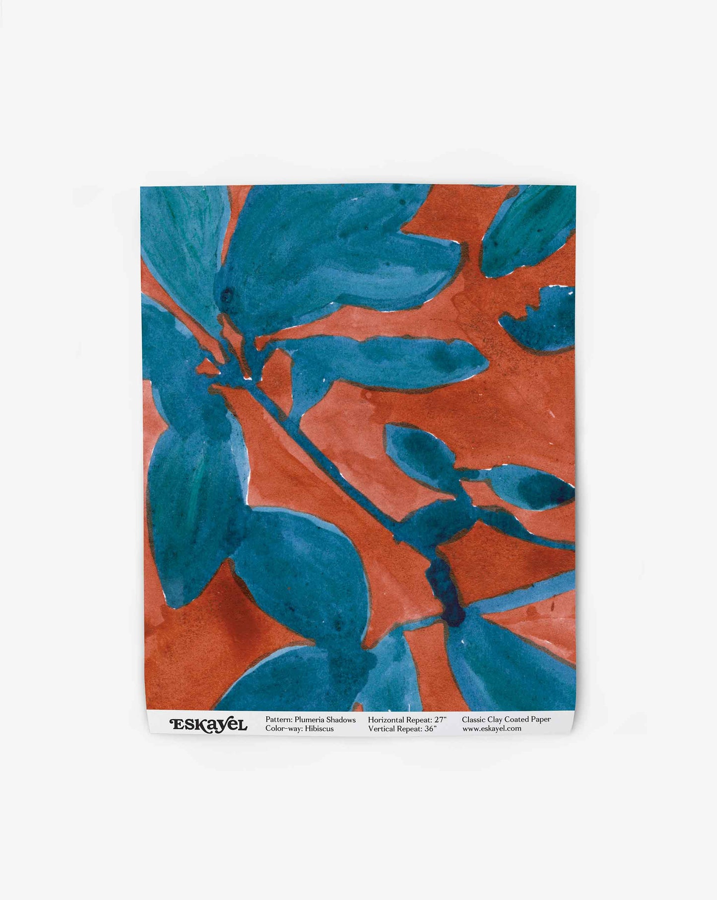 A wallpaper swatch image of Plumeria Shadows pattern in Hibiscus, a colorway featuring a rich red background and deep blue leaves | Eskayel