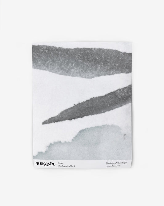 a sample of the Sedge Mural Wallpaper Sample with grey abstract pieces on it