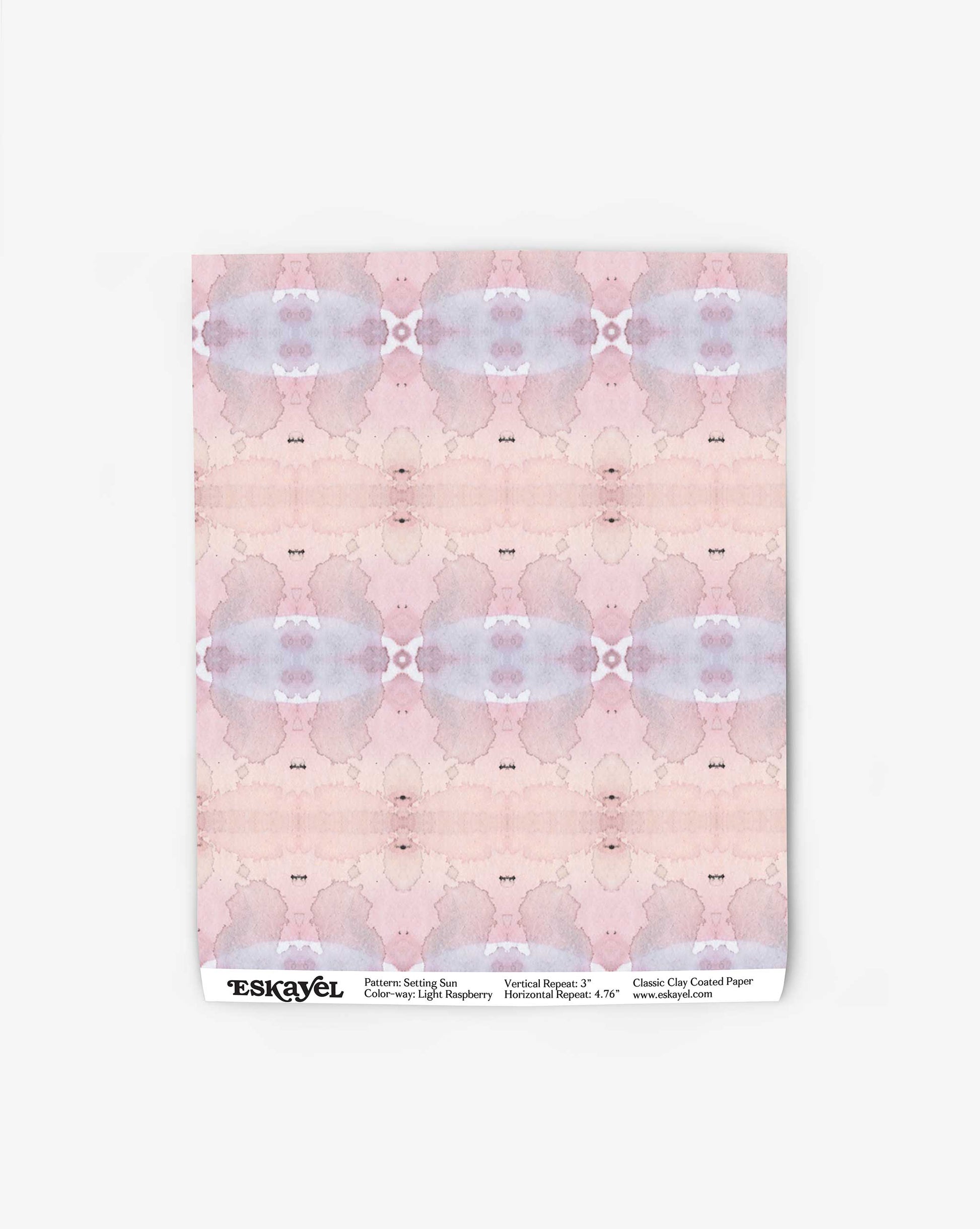 A sheet of light raspberry, abstract-patterned paper with the brand name "Setting Sun Wallpaper||Light Raspberry" and product details printed at the bottom.
